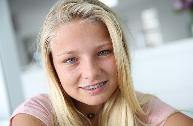 Young girl with pediatric orthodontics sharing her smile
