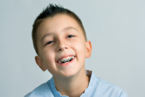 Smiling boy with Phase 1 orthodontics