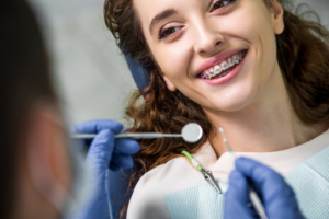 a patient having their braces removed 